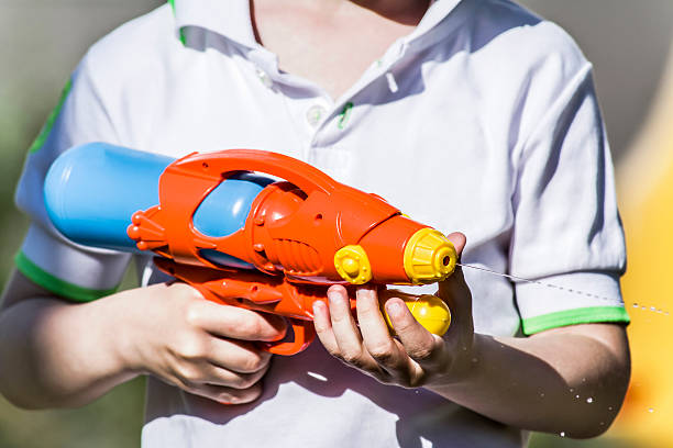istock Boy with water pistol 484125818