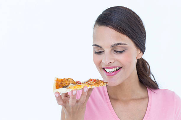 istock Beautiful woman eating a pizza 484130046