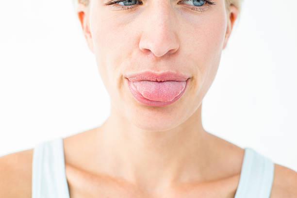 istock Pretty blonde showing her tongue 484131238