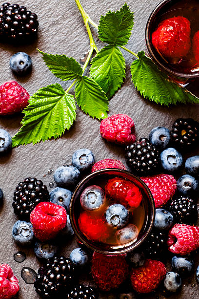 istock Juice of wild berries on a dark background 484131426