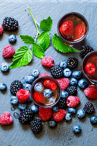 istock Juice of wild berries on a dark background 484131428