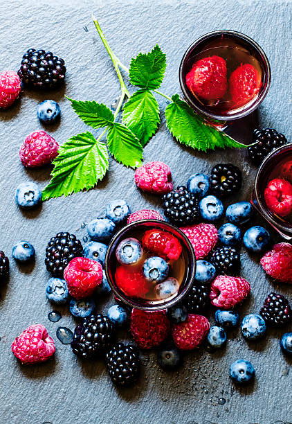 istock Juice of wild berries on a dark background 484131434