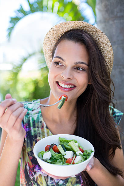 istock Smiling beautiful brunette having a picnic 484133108