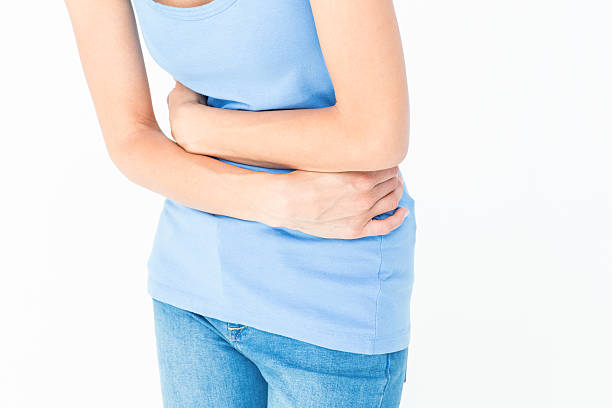 istock Woman suffering from stomach pain 484134094