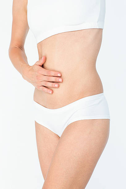 istock Woman touching her belly 484134156
