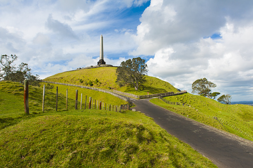 Obelisk on the summit of the One Tree Hill reminds of signing the Treaty of Waitangi, the treaty of the Maori people with the British Empire. Auckland, New Zealand