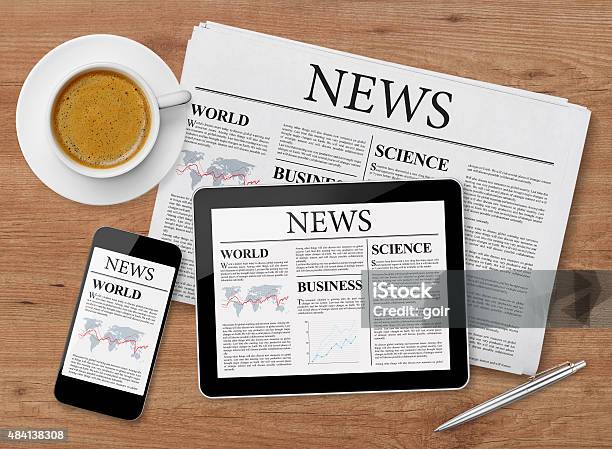 News Page On Tablet Mobile Phone And Newspaper Stock Photo - Download Image Now - Newspaper, News Event, The Media