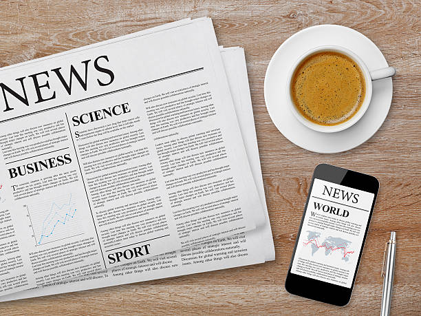 istock News page on tablet, newspaper and coffee 484138324