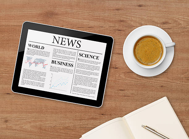 istock News page on tablet and coffee cup 484138330