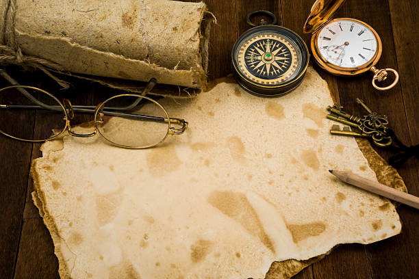 istock Old paper, compass, pocket watch on wooden background 484138558