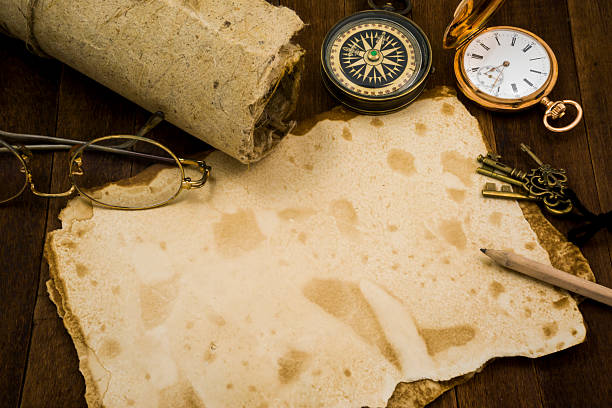 istock Old paper, compass, pocket watch on wooden background 484138732