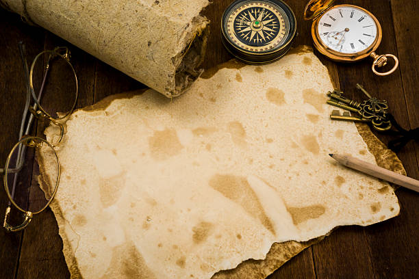 istock Old paper, compass, pocket watch on wooden background 484138734