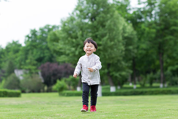 istock run on the lawn asian boy 484138976