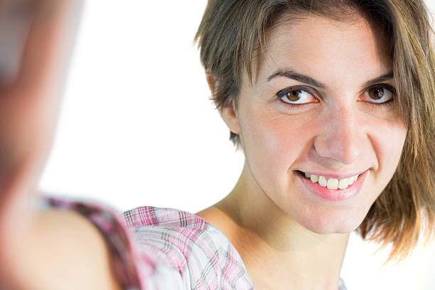 istock Casual brunette taking a selfie 484139382