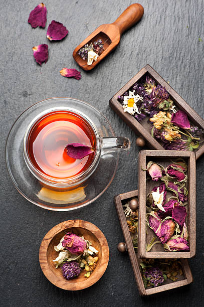 istock herbal tea with honey and dried herbs and flowers. 484139566