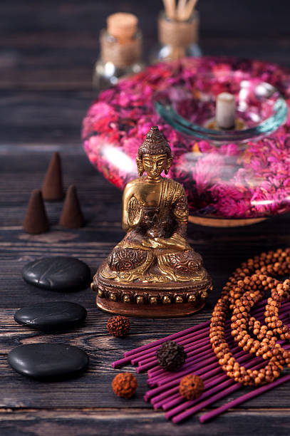 istock aromatherapy and spa. Buddha statue, stone massage and incense sticks 484139852