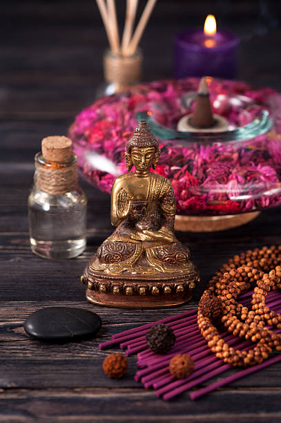 istock aromatherapy and spa. Buddha statue, stone massage and incense sticks 484139882