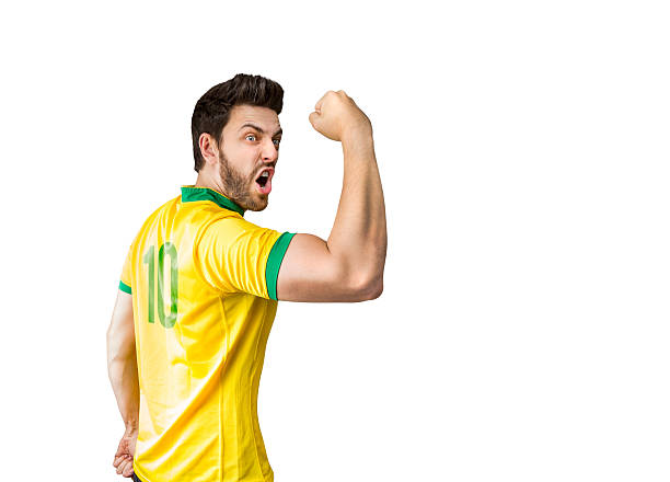 istock Brazilian soccer player celebrates on white background 484140458