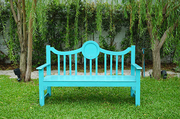 istock Turqouise color garden bench 484144242