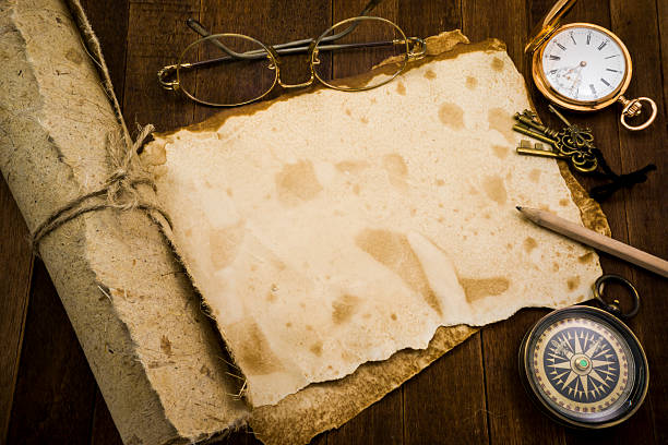 istock Old paper, compass, pocket watch on wooden background 484147624