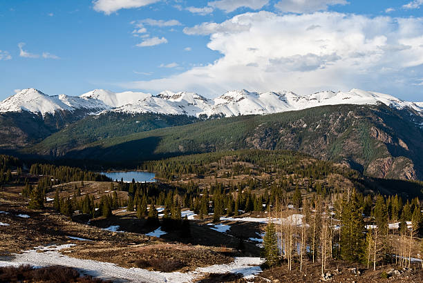 Molas Lake and Snow Capped San Juan Mountains Molas Pass, at 10,910', is a high mountain pass in the San Juan Mountains of Western Colorado, USA. The pass which is part of the "Million Dollar Highway" offers sweeping vistas of the San Juan Mountains. The pass is also near the 500 mile Colorado Trail which goes from Denver to Durango along the Continental Divide of the USA. jeff goulden san juan mountains stock pictures, royalty-free photos & images