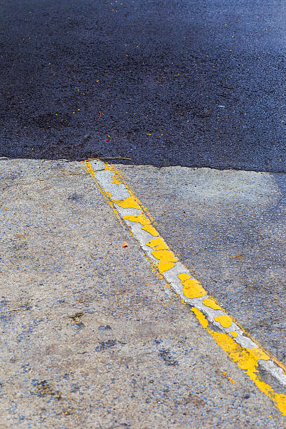 istock yellow line on the road texture 484149998
