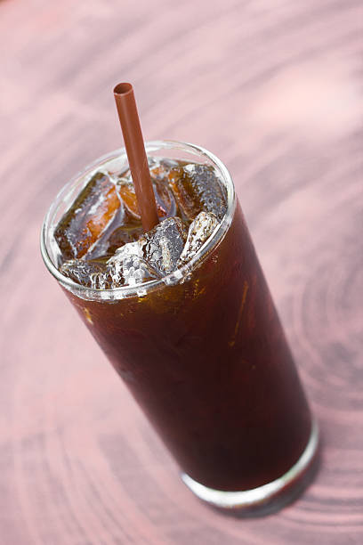 istock Iced Americano on wood table. 484150308