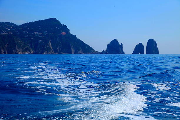 istock Ships crossing Faraglioni cliffs in Capri, Amalfi Coast 484155408