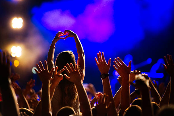 Concert Crowd Cheering crowd at concert  rock musician photos stock pictures, royalty-free photos & images