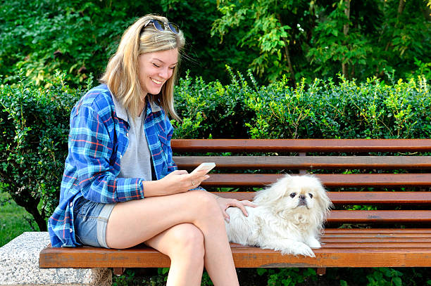 istock Girl using a cell phone outdoors. 484161458
