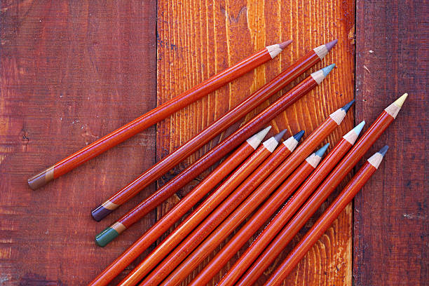 Pencils on wooden background stock photo