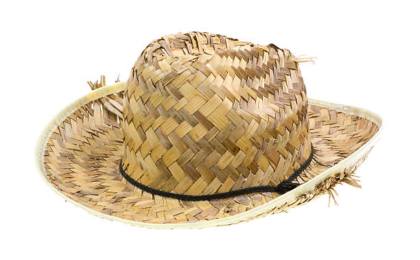 Old straw hat Side view of an old woven straw hat with the straw parting from the brim on a white background. straw hat photos stock pictures, royalty-free photos & images