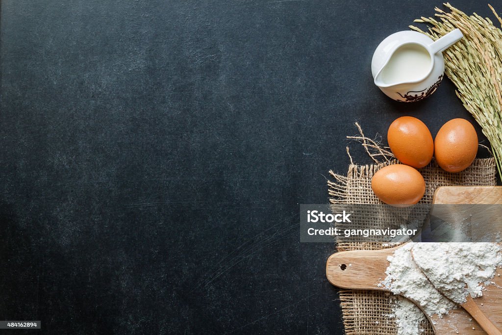 Baking powder milk and eggs on chalkboard for background 2015 Stock Photo