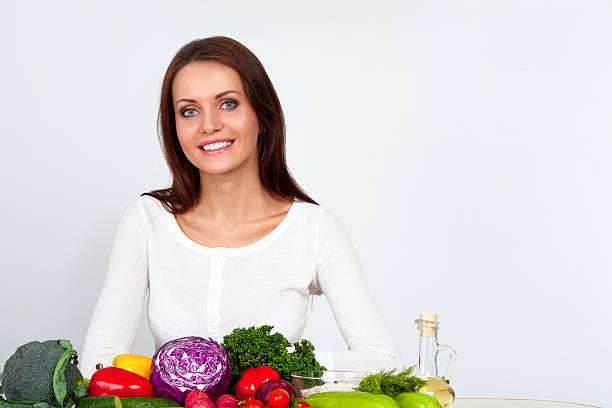 istock happy young woman with vegetables 484163873