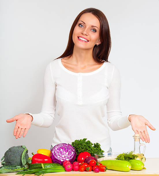 istock happy young woman with vegetables 484164821