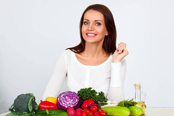 istock happy young woman with vegetables 484164827