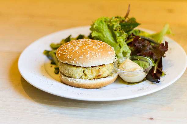 istock Fish burger, salad, mayonnaise and zucchini 484166025
