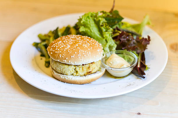 istock Fish burger, salad, mayonnaise and zucchini 484166027
