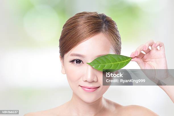 Beautiful Woman Face Portrait With Green Leaf Stock Photo - Download Image Now - Adult, Animal Body Part, Animal Skin