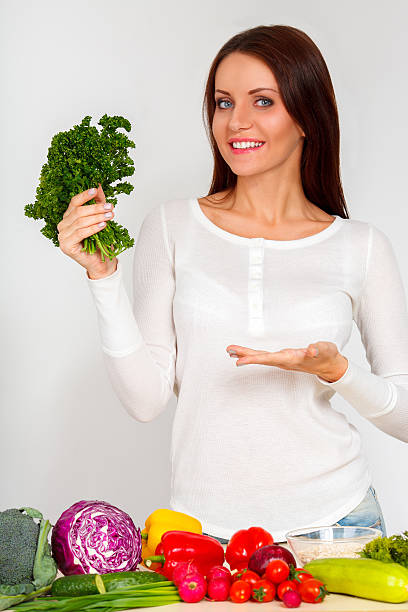 istock happy young woman with vegetables 484166651