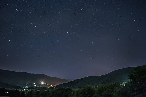 istock Starry sky over French village in mountains 484167514
