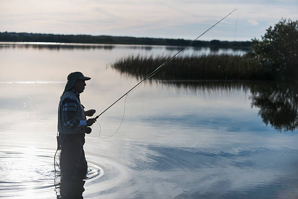 istock Senior man fly fishing 484168163