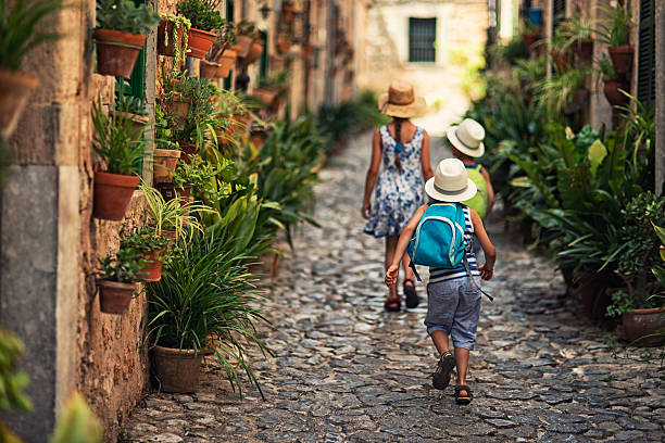 Kids walking in mediterranean street.