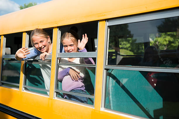 istock Two littles girls in a school bus 484169526