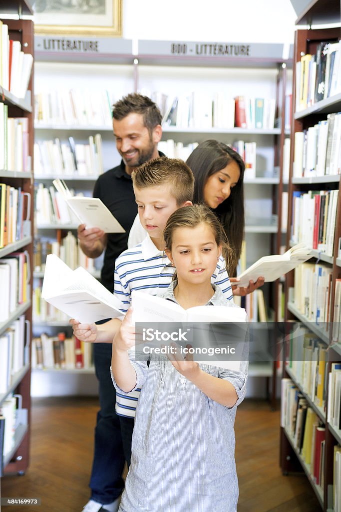 In Library Series with group of children and adults in French library. http://iconogenic.com/STOCK/iconchildren.jpg Shot during iStockalypse in Cannes. ÃÂ«PhotographiÃÂ© Ã Cannes, CÃÂ ́te dÃ¢ÂÂAzur, France. Shot in Cannes, CÃÂ ́te dÃ¢ÂAzur, FranceÃÂ». Adult Stock Photo