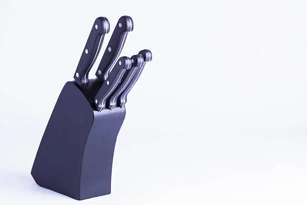 Chef's knife block on white background for concepts of cooking and preparing food