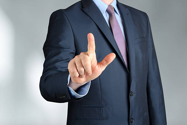 istock Bisinessman  in a modern suit Touching  something by hand. 484185736