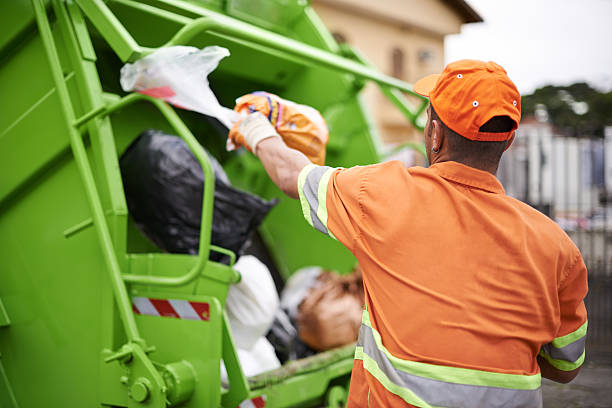 One man's trash... Cropped shot of a garbage collection worker rubbish dump stock pictures, royalty-free photos & images