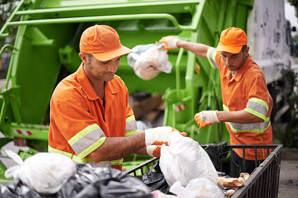 Dealing with your mess daily Cropped shot of a garbage collection team at work street sweeper stock pictures, royalty-free photos & images