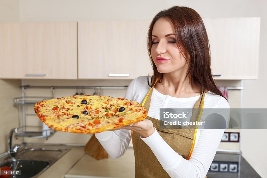 Happy Young Woman Cooking Pizza at Home. Oven Adult Stock Photo